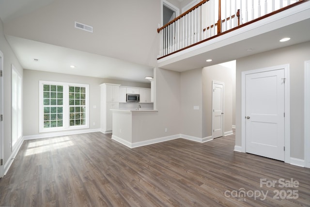 248 Pioneer Dr, Mount Gilead, NC 27306 - unfurnished living room with high vaulted ceiling, dark wood-style floors, and recessed lighting