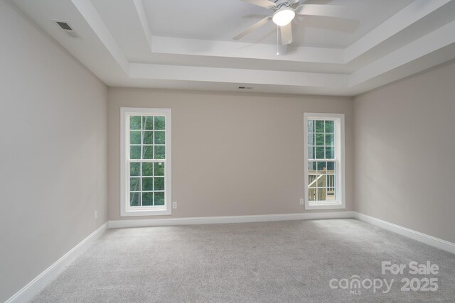 248 Pioneer Dr, Mount Gilead, NC 27306 - carpeted spare room with a tray ceiling and a ceiling fan