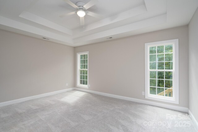 248 Pioneer Dr, Mount Gilead, NC 27306 - unfurnished room with a tray ceiling, carpet flooring, and ceiling fan