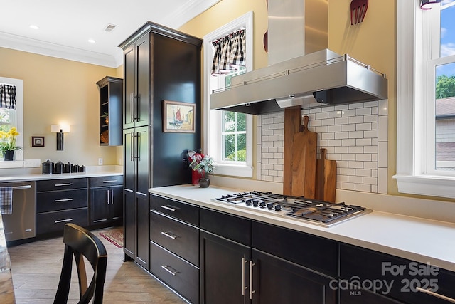 2354 Valelake Rd, York, SC 29745 - kitchen with wall chimney range hood, ornamental molding, appliances with stainless steel finishes, backsplash, and light countertops