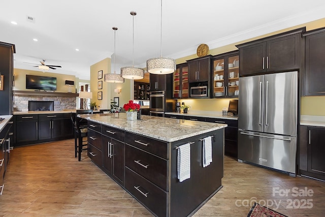 2354 Valelake Rd, York, SC 29745 - kitchen with stainless steel appliances, crown molding, open floor plan, a center island, and a ceiling fan
