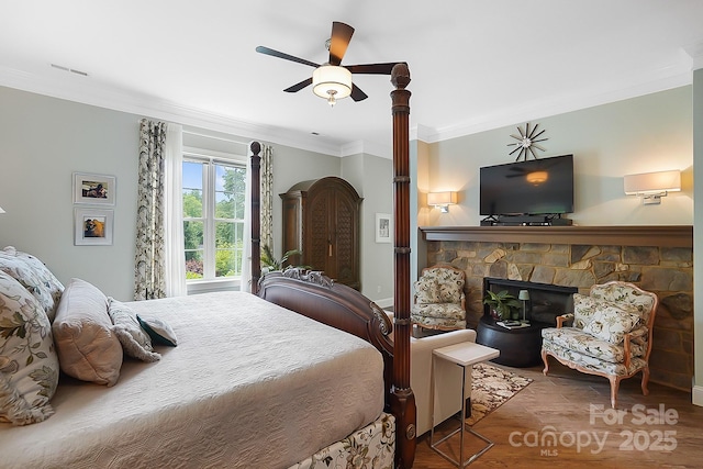 2354 Valelake Rd, York, SC 29745 - bedroom featuring crown molding, a stone fireplace, wood finished floors, and ceiling fan