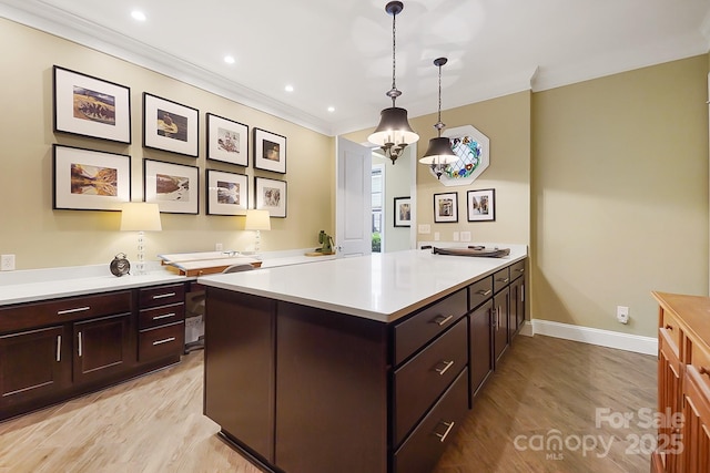 2354 Valelake Rd, York, SC 29745 - kitchen with a peninsula, light wood finished floors, light countertops, baseboards, and decorative light fixtures