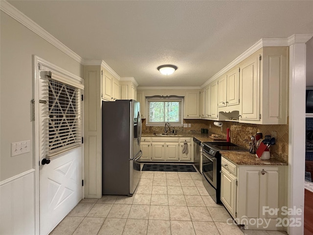 18 Olde Duffers Dr, Nebo, NC 28761 - kitchen with stainless steel appliances, a sink, tasteful backsplash, ornamental molding, and light tile patterned flooring