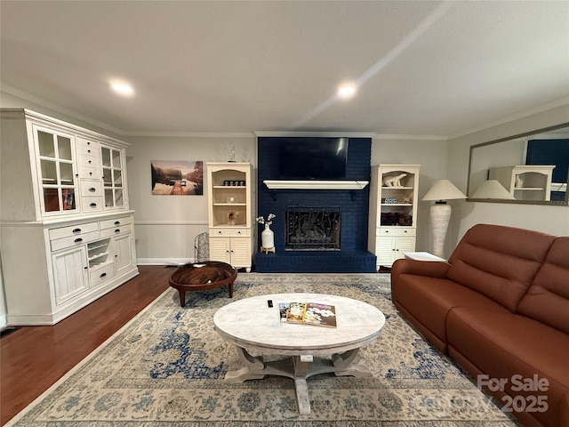 18 Olde Duffers Dr, Nebo, NC 28761 - living area with crown molding, dark wood-type flooring, a brick fireplace, baseboards, and recessed lighting