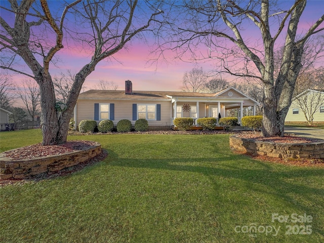 2316 Woodfield Cir, Gastonia, NC 28056 - ranch-style home with a porch, a chimney, and a front yard