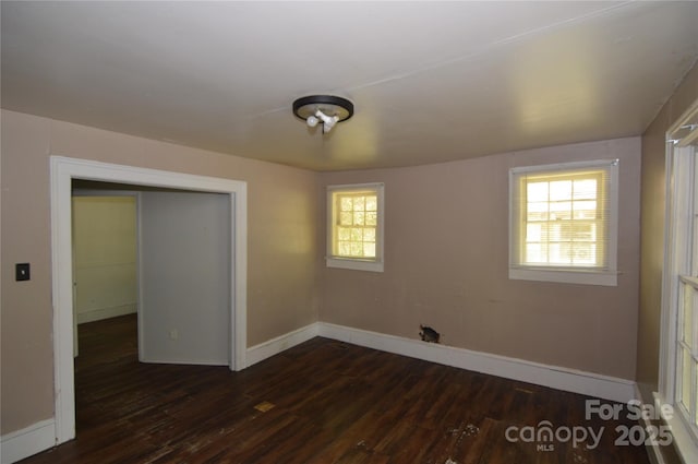 1216 Mountain Ave, Gastonia, NC 28052 - empty room featuring dark wood-style flooring and baseboards