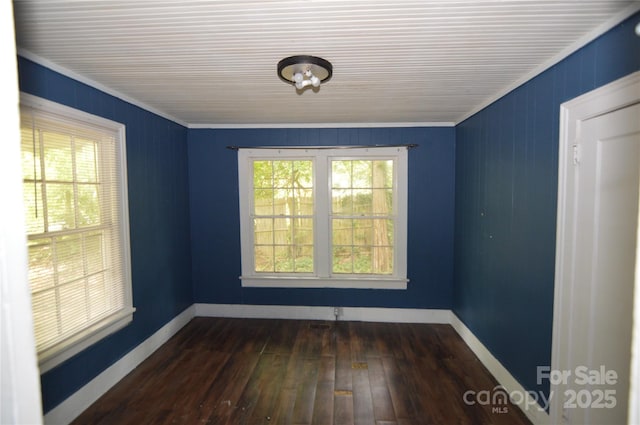 1216 Mountain Ave, Gastonia, NC 28052 - spare room featuring healthy amount of natural light, dark wood-type flooring, and baseboards