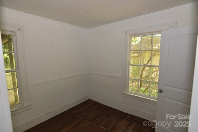 1216 Mountain Ave, Gastonia, NC 28052 - unfurnished room featuring dark wood-style floors, healthy amount of natural light, and crown molding