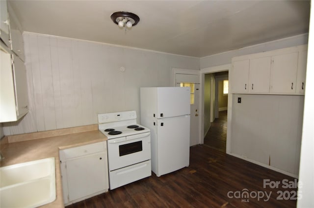 1216 Mountain Ave, Gastonia, NC 28052 - kitchen featuring white appliances, dark wood-style flooring, light countertops, and white cabinets