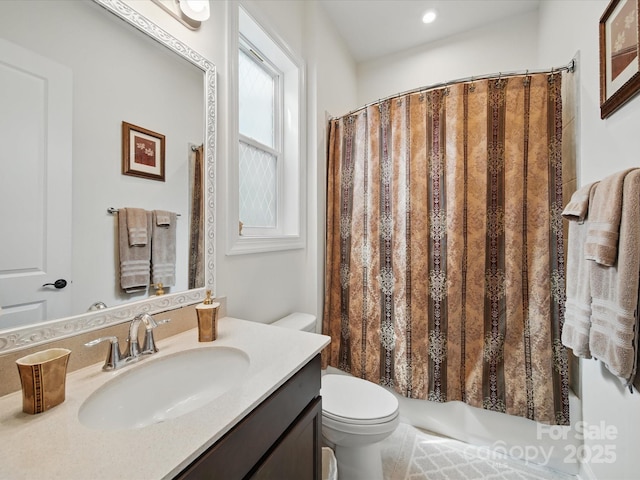 6015 Waldorf Ave, Monroe, NC 28110 - bathroom featuring toilet, vanity, and shower / bath combo with shower curtain
