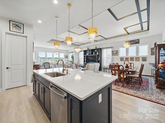 6015 Waldorf Ave, Monroe, NC 28110 - kitchen with a sink, stainless steel dishwasher, light wood finished floors, open floor plan, and light countertops
