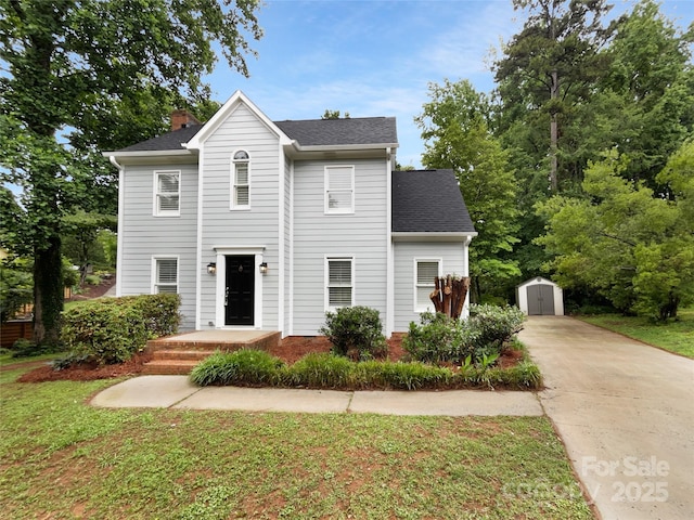 124 Creek Hollow Trl, Belmont, NC 28012 - view of front of property featuring a chimney, a front yard, concrete driveway, and a shingled roof