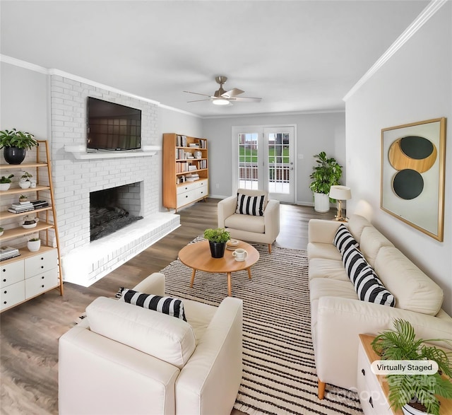 124 Creek Hollow Trl, Belmont, NC 28012 - living area with ornamental molding, ceiling fan, wood finished floors, and a brick fireplace