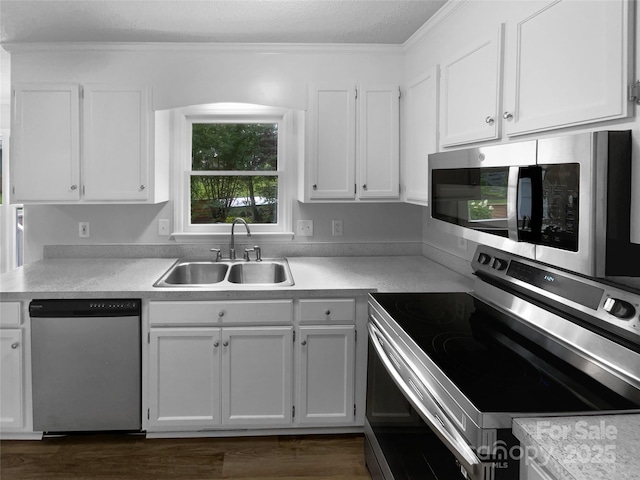 124 Creek Hollow Trl, Belmont, NC 28012 - kitchen featuring stainless steel appliances, a sink, white cabinetry, light countertops, and crown molding