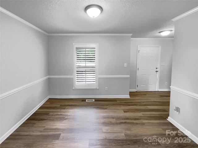124 Creek Hollow Trl, Belmont, NC 28012 - spare room featuring a textured ceiling, wood finished floors, baseboards, and ornamental molding