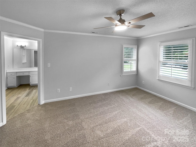 124 Creek Hollow Trl, Belmont, NC 28012 - empty room featuring light colored carpet, ceiling fan, a textured ceiling, crown molding, and baseboards