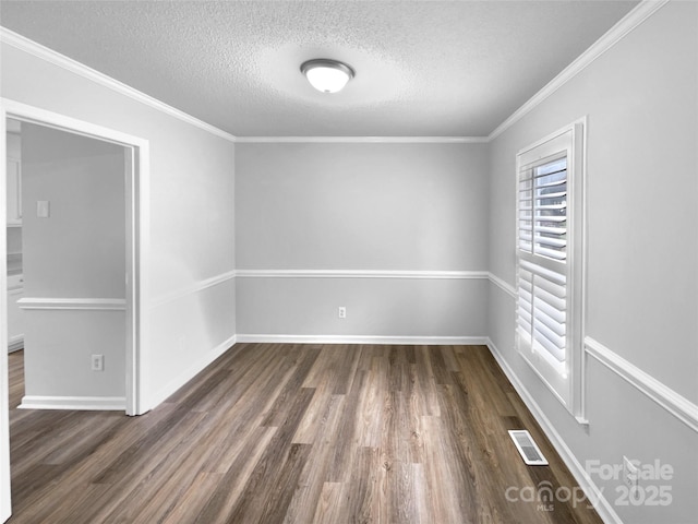 124 Creek Hollow Trl, Belmont, NC 28012 - empty room with dark wood-type flooring, a textured ceiling, baseboards, and ornamental molding