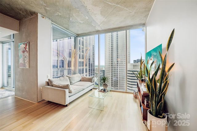 210 N Church St Unit 2807, Charlotte, NC 28202 - living area featuring wood finished floors, a wall of windows, and healthy amount of natural light