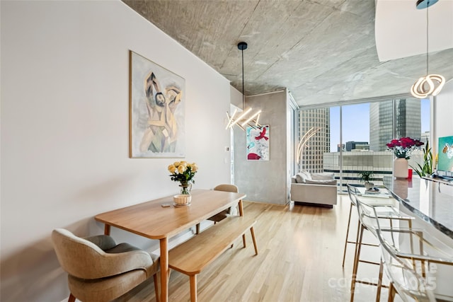 210 N Church St Unit 2807, Charlotte, NC 28202 - dining space featuring wood finished floors and a wall of windows