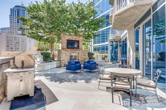 210 N Church St Unit 2807, Charlotte, NC 28202 - view of patio with an outdoor living space with a fireplace