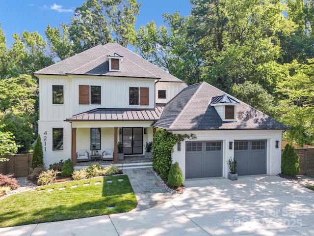 4211 Tangle Dr, Charlotte, NC 28211 - modern farmhouse style home with a standing seam roof, covered porch, roof with shingles, concrete driveway, and a garage