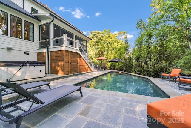 4211 Tangle Dr, Charlotte, NC 28211 - outdoor pool with a hot tub, a patio, a sunroom, and stairway