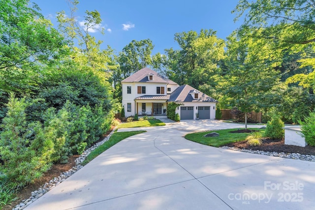 4211 Tangle Dr, Charlotte, NC 28211 - victorian house featuring driveway, a garage, and stucco siding
