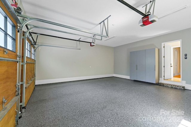 4211 Tangle Dr, Charlotte, NC 28211 - garage with a garage door opener and baseboards