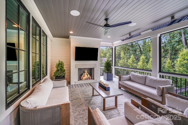 4211 Tangle Dr, Charlotte, NC 28211 - sunroom / solarium featuring an outdoor living space with a fireplace, ceiling fan, and healthy amount of natural light