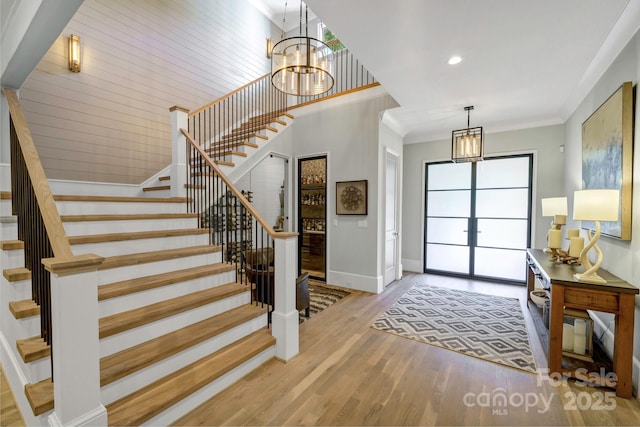 4211 Tangle Dr, Charlotte, NC 28211 - entryway with a chandelier, baseboards, stairway, wood finished floors, and recessed lighting