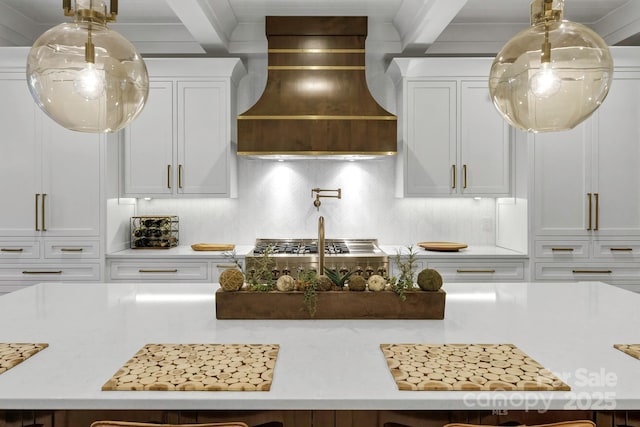 4211 Tangle Dr, Charlotte, NC 28211 - kitchen featuring custom exhaust hood, backsplash, light countertops, white cabinets, and beamed ceiling
