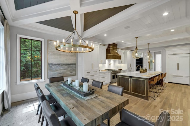 4211 Tangle Dr, Charlotte, NC 28211 - dining area with a chandelier, light wood-style flooring, beamed ceiling, recessed lighting, and baseboards