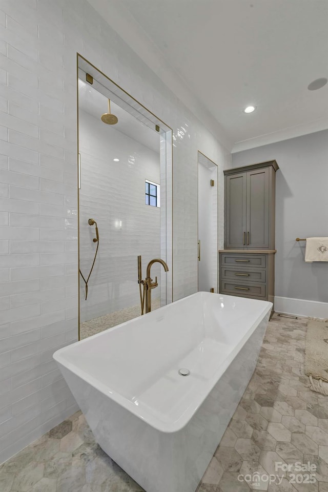 4211 Tangle Dr, Charlotte, NC 28211 - bathroom with a freestanding bath, walk in shower, ornamental molding, and recessed lighting
