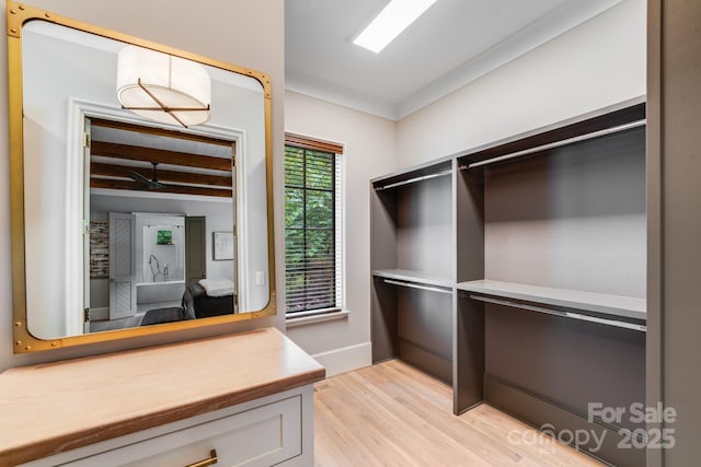 4211 Tangle Dr, Charlotte, NC 28211 - spacious closet featuring light wood-style floors and beam ceiling