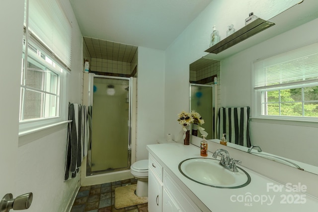 1867 Shannon Dr, Conover, NC 28613 - full bath with toilet, vanity, a stall shower, and stone finish floors