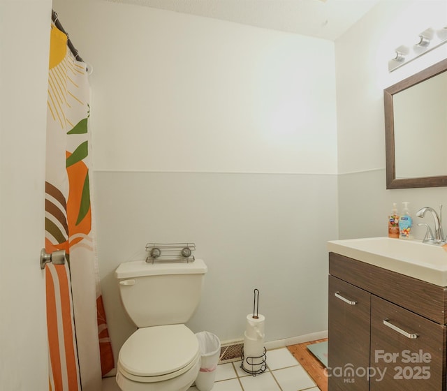 1867 Shannon Dr, Conover, NC 28613 - bathroom featuring vanity, toilet, and tile patterned floors