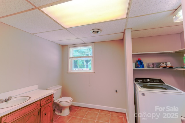 1867 Shannon Dr, Conover, NC 28613 - bathroom with washer / clothes dryer, toilet, vanity, tile patterned flooring, and a drop ceiling