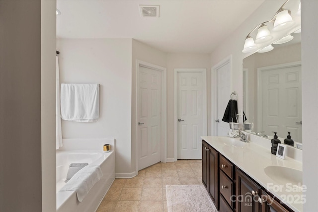197 Roanoke Rd, Fletcher, NC 28732 - bathroom with double vanity, a bath, and baseboards