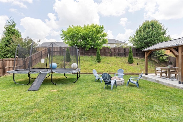 197 Roanoke Rd, Fletcher, NC 28732 - view of yard featuring a trampoline, an outdoor fire pit, and a gazebo