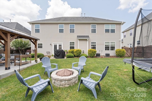 197 Roanoke Rd, Fletcher, NC 28732 - rear view of property featuring a fire pit, a patio area, a gazebo, and central air condition unit