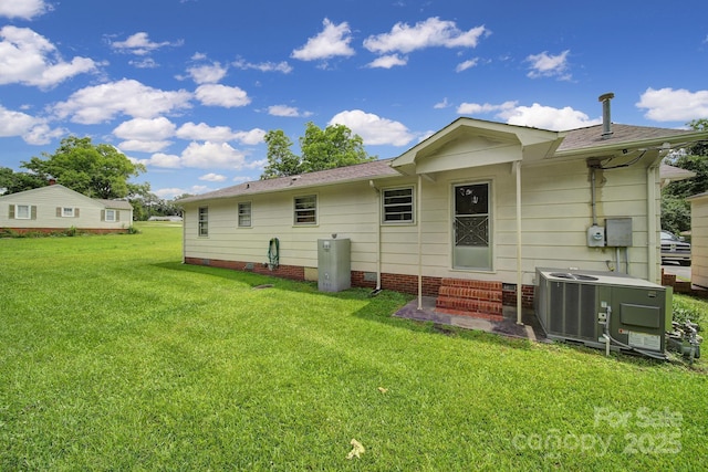 2084 Old Evans Cir, Lancaster, SC 29720 - rear view of house featuring entry steps, central AC, and a yard