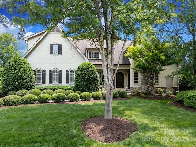 1103 Mapesbury Ln, Waxhaw, NC 28173 - view of front facade featuring a front yard and stucco siding
