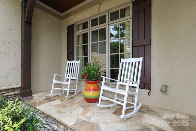 1103 Mapesbury Ln, Waxhaw, NC 28173 - doorway to property featuring stucco siding and covered porch
