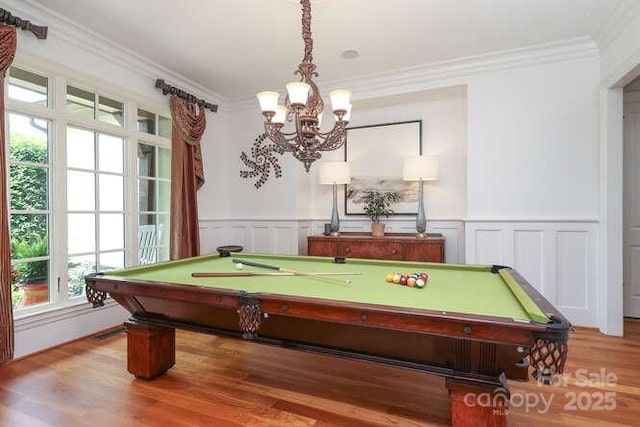 1103 Mapesbury Ln, Waxhaw, NC 28173 - game room with billiards table, a chandelier, plenty of natural light, wood finished floors, and ornamental molding
