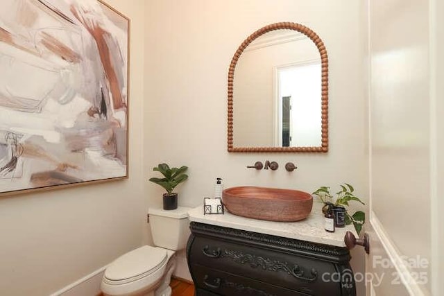 1103 Mapesbury Ln, Waxhaw, NC 28173 - bathroom with toilet, vanity, and baseboards