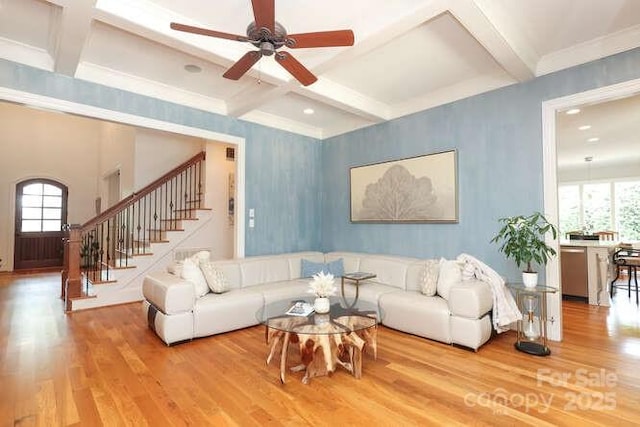 1103 Mapesbury Ln, Waxhaw, NC 28173 - living area featuring wood finished floors, coffered ceiling, stairway, ceiling fan, and beam ceiling