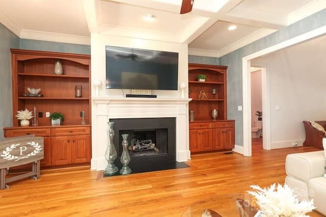 1103 Mapesbury Ln, Waxhaw, NC 28173 - living area with light wood-style floors, a fireplace with flush hearth, coffered ceiling, crown molding, and baseboards