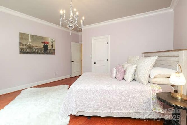 1103 Mapesbury Ln, Waxhaw, NC 28173 - bedroom with ornamental molding, a chandelier, wood finished floors, and baseboards