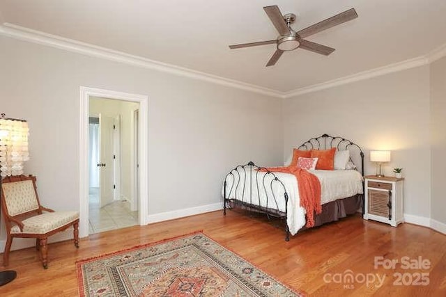 1103 Mapesbury Ln, Waxhaw, NC 28173 - bedroom with crown molding, wood finished floors, baseboards, and ceiling fan